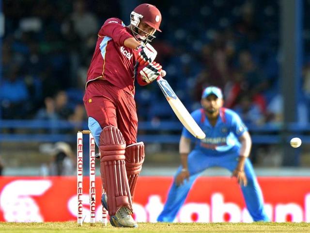 West Indies' Sunil Narine plays a shot during the fourth match of the Tri-Nation series between India and West Indies at the Queen's Park Oval in Port of Spain. AFP Photo