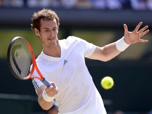 Andy Murray returns against Novak Djokovic during the Wimbledon men's singles final in Wimbledon, southwest London. AFP Photo