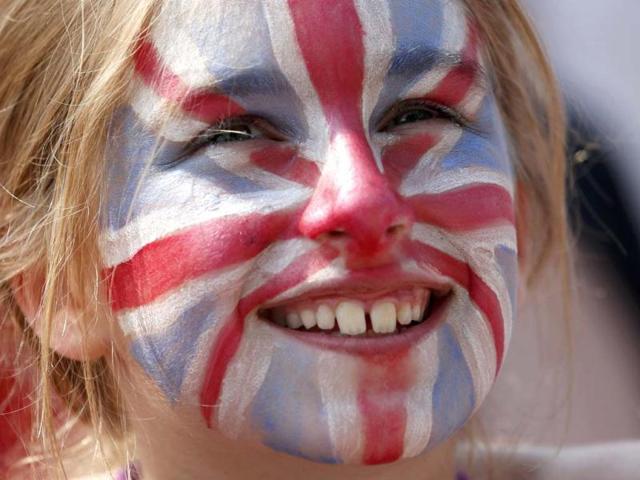 Zoe Bell from London watches the men's singles final tennis match between Andy Murray and Novak Djokovic on the big screen at Murray Mound at the Wimbledon Tennis Championships, in London. Reuters