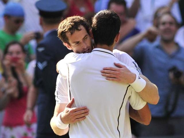 Andy Murray embraces Novak Djokovic after Murray's victory in Wimbledon men's singles final in Wimbledon. AFP Photo