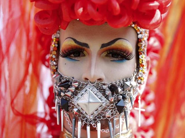 A reveller takes part in the Christopher Street Day parade in Cologne, Germany to demonstrate for the rights of all lesbian, gay, bisexual, transgender and transsexual (LGBT) people and to commemorate clashes between gay people and the US police in New York City's Christopher Street in June 1969 during the Stonewall Riots. Reuters