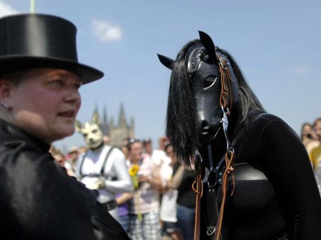 A reveller dressed as horse takes part in the Christopher Street Day parade in Cologne to demonstrate for the rights of all lesbian, gay, bisexual, transgender and transsexual people. Reuters