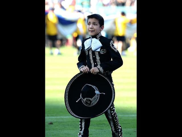 11-year-old mariachi singer Sebastian De La Cruz poses after an attempt with 599 other mariachi performers to break the Guiness World Records title for the most mariachi musicians performing together in California. (AFP)