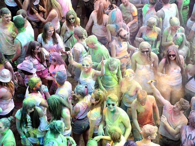 People throw colorful powder during the Holi Festival of Colours in Germany. (AFP)