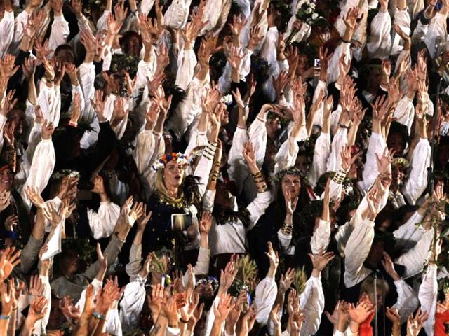 Singers in traditional costumes perform during the gala show of the Latvian Nationwide Song and Dance Celebration in Latvia. (Reuters)
