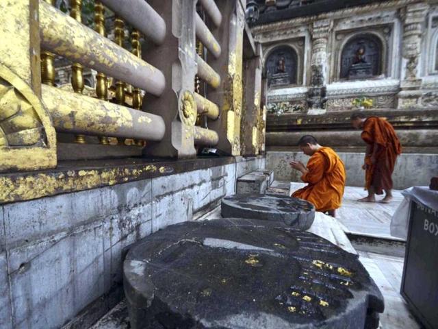 Buddhist monks offer prayers a day after a series of blasts hit Mahabodhi temple in Bodh Gaya at the site. (AP Photo)