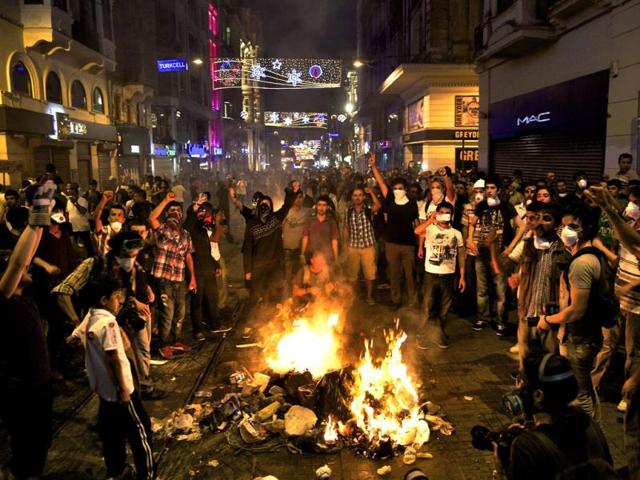 Protesters shout slogans as they block the main Istiklal street in central Istanbul, Turkey. (Reuters Photo)