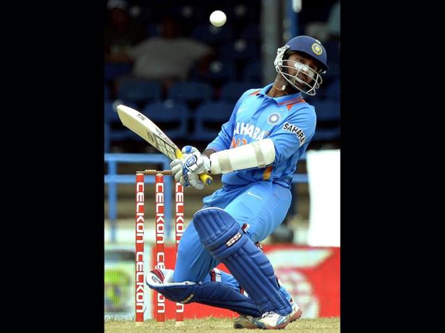 Indian cricketer Dinesh Karthik avoids a bouncer during the sixth match of the tri-nation series between India and Sri Lanka at the Queen's Park Oval stadium in Port of Spain. (AFP Photo)
