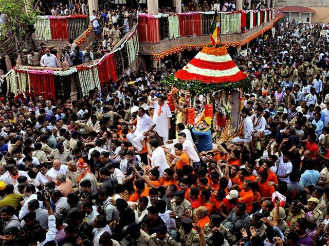 Devotees pulling chariot in Ahmedabad. PTI Photo