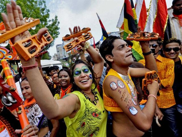 Devotees celebrate on the occasion of annual 136th Rath Yatra in Ahmadabad. PTI