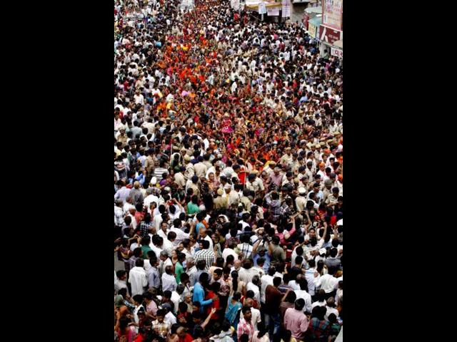 Devotees throng streets in Ahmedabad . PTI