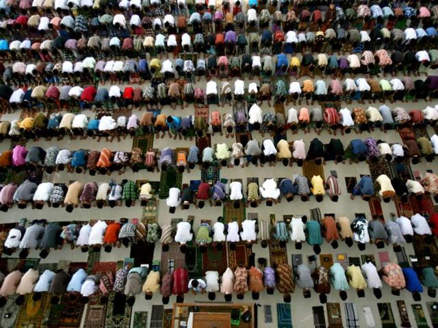 Students offering prayers on the first day of the holy fasting month of Ramadan, at Ar-Raudlatul Hasanah Islamic boarding school in Medan, North Sumatra, Indonesia, Wednesday, July 10, 2013. During Ramadan Muslims refrain from eating, drinking, smoking and sex from dawn to dusk. AP Photo
