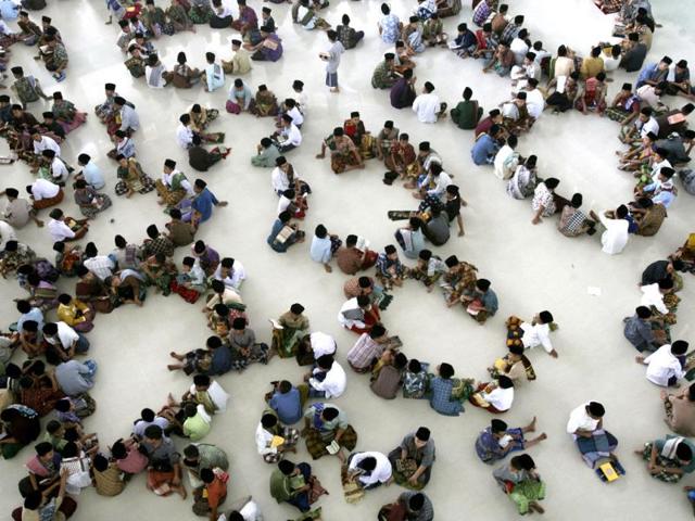 Students sit in circles during a Quran recital class on the first day of the holy fasting month of Ramadan, at Ar-Raudlatul Hasanah Islamic boarding school in Medan, North Sumatra, Indonesia, Wednesday, July 10, 2013. During Ramadan Muslims refrain from eating, drinking, smoking and sex from dawn to dusk. AP Photo