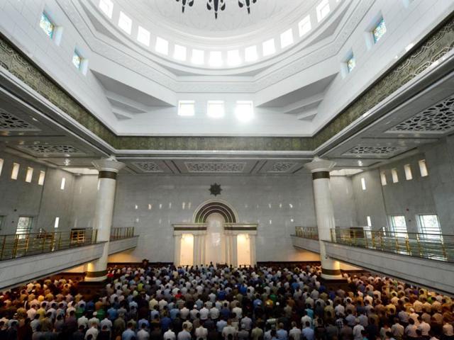 Indonesian Muslims pray at a mosque on the first day of the holy month of Ramadan in Jakarta on July 10, 2013. Islam's holy month of Ramadan is celebrated by Muslims worldwide marked by fasting, abstaining from foods, sex and smoking from dawn to dusk for soul cleansing and strengthening the spiritual bond between them and the Almighty. AFP PHOTO