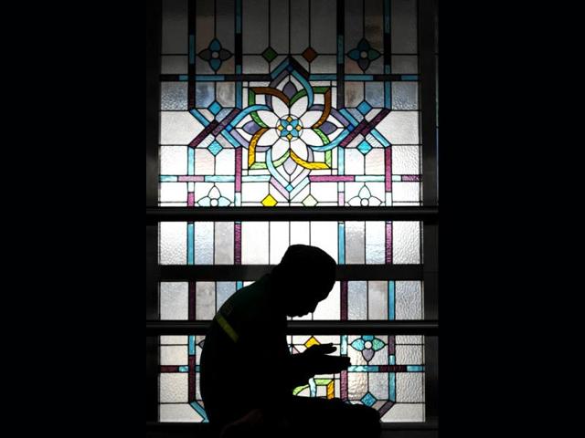 An Indonesian Muslim man prays at a mosque on the first day of the holy month of Ramadan in Jakarta on July 10, 2013. Islam's holy month of Ramadan is celebrated by Muslims worldwide marked by fasting, abstaining from foods, sex and smoking from dawn to dusk for soul cleansing and strengthening the spiritual bond between them and the Almighty. AFP PHOTO