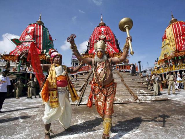 Traditional dancers of the Shree Jagannath temple dance during the annual rath yatra or chariot procession of Lord Jagannath in Puri, 60 kilometers (37 miles) from Bhubaneswar. (AP Photo)