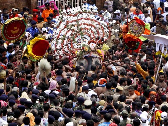 Hindu devotees carry the idol of Lord Jagannath for the rath yatra or chariot procession in Puri, 60 kilometers (37 miles) from Bhubaneswar. (AP Photo)