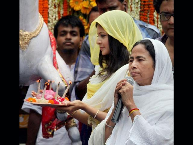 West Bengal chief minister Mamata Banerjee and Tollywood actress Koyal Mullick standing in front of a chariot during rath yatra in Kolkata. (PTI Photo)