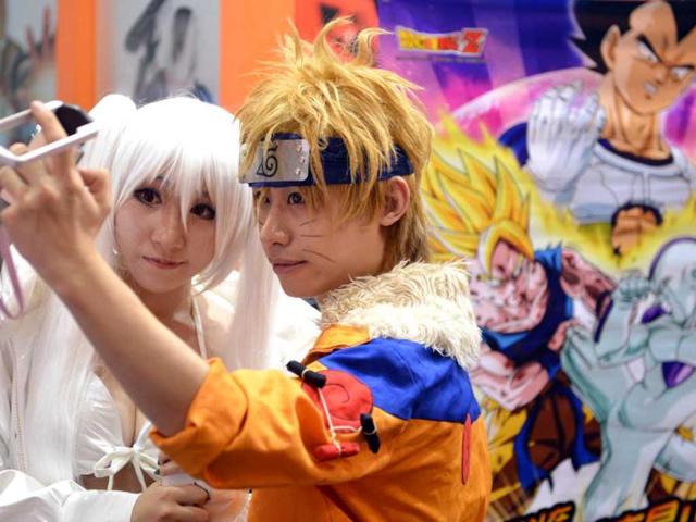 Cosplay fans poses for photos on the opening day of the 9th China International Comics Games Expo (CCG Expo) in Shanghai. AFP Photo