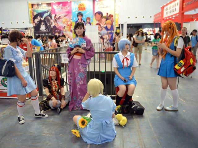 Cosplay fans take a rest on the opening day of the 9th China International Comics Games Expo (CCG Expo) in Shanghai. AFP Photo