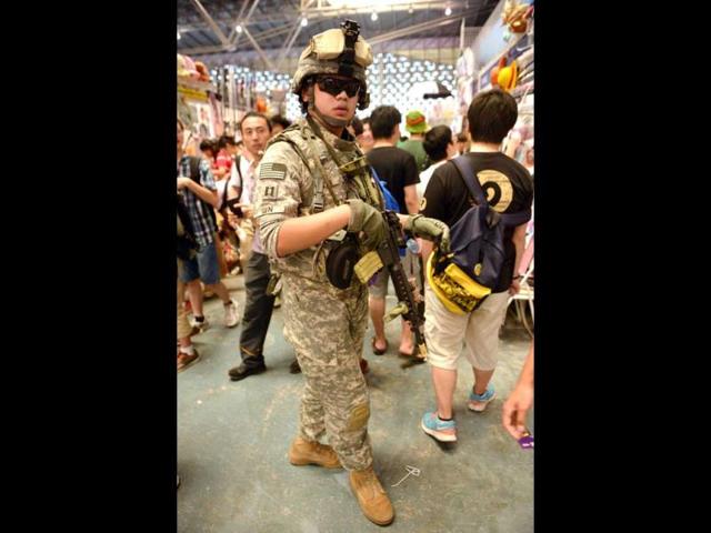 A visitor dresses as a US soldier on the opening day of the 9th China International Comics Games Expo (CCG Expo) in Shanghai. AFP Photo