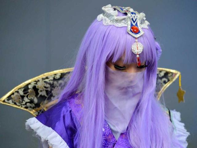A cosplay fan gets ready on the opening day of the 9th China International Comics Games Expo (CCG Expo) in Shanghai. AFP Photo