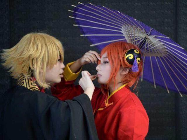 Cosplay fans get ready on the opening day of the 9th China International Comics Games Expo (CCG Expo) in Shanghai. AFP Photo