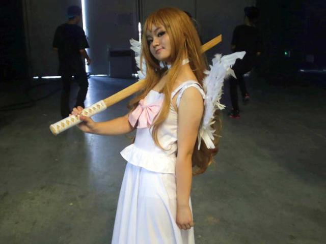 A costumed visitor with a wooden sword poses during the China International Comics and Games Expo in Shanghai, China. AP Photo