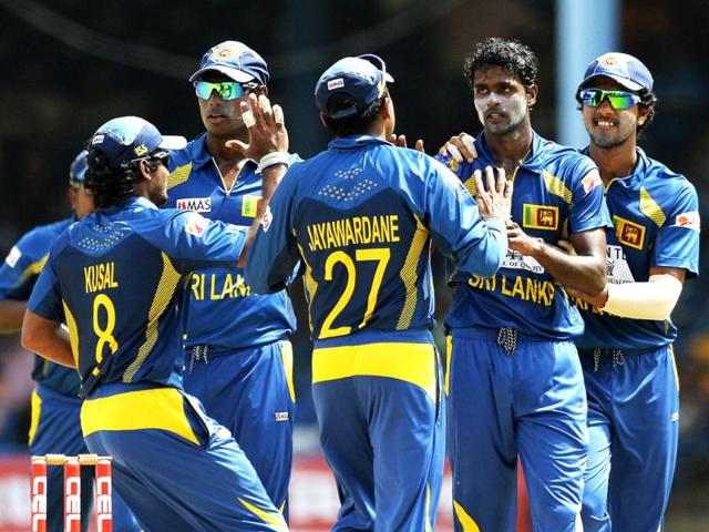 Shaminda Eranga celebrates with teammates after dismissing Shikhar Dhawan Tri-Nation series final at the Queen's Park Oval stadium in Port of Spain. (AFP Photo)