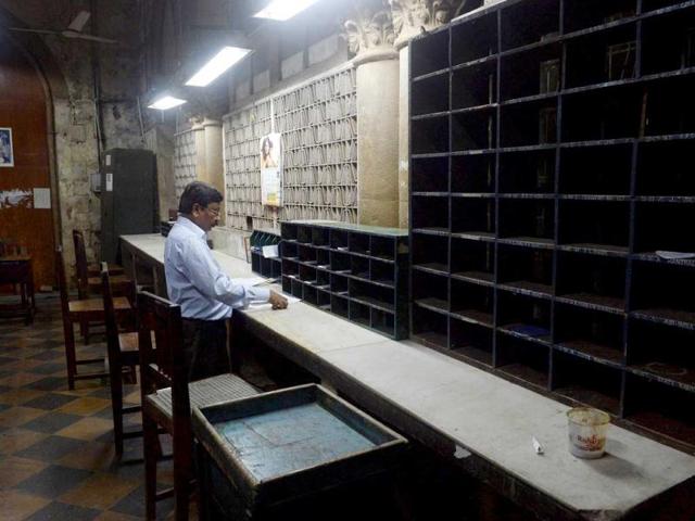 An employee sorts incoming telegram messages at the dispatch section of the Central Telegraph Office in Mumbai. (AFP Photo)