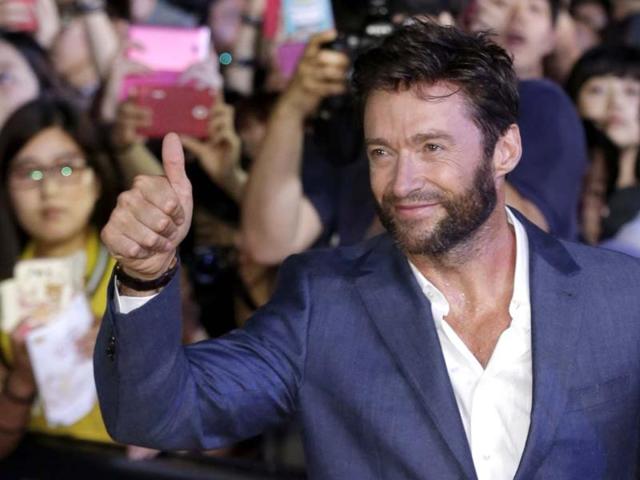 Actor Hugh Jackman gives a thumbs-up to his fans during the premiere event of his new film 'The Wolverine' in Seoul, South Korea. (AP Photo)