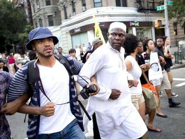 Demonstrators march through the Lower East Side neighborhood of Manhattan in New York, during a protest against the acquittal of George Zimmerman in the killing of 17-year-old Trayvon Martin. (AP Photo)