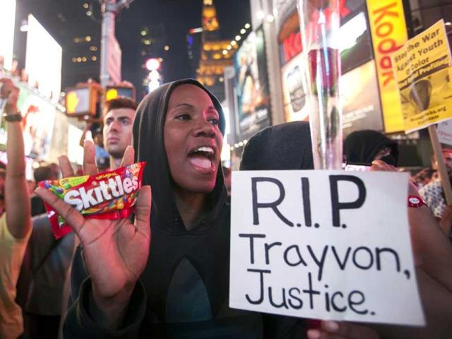 Protester Keisha Martin-Hall holds a bag of Skittles as she participates in a rally in response to the acquittal of George Zimmerman in the Trayvon Martin trial at Times Square. (Reuters Photo)