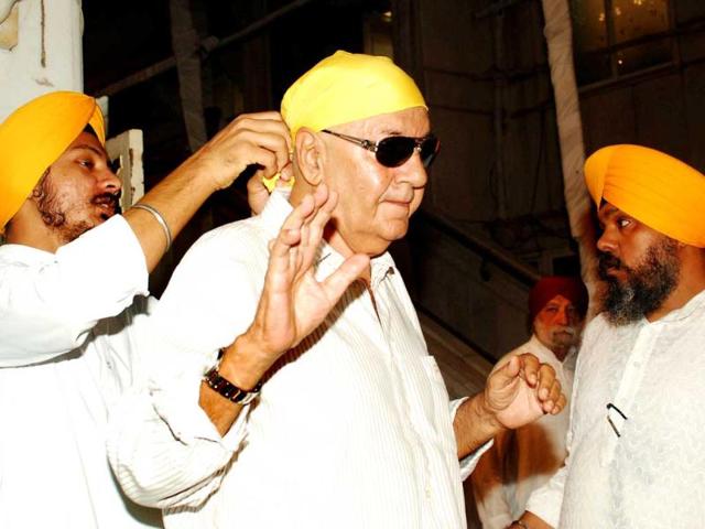 Actor Prem Chopra gets a cloth tied to his head at the prayer meet.