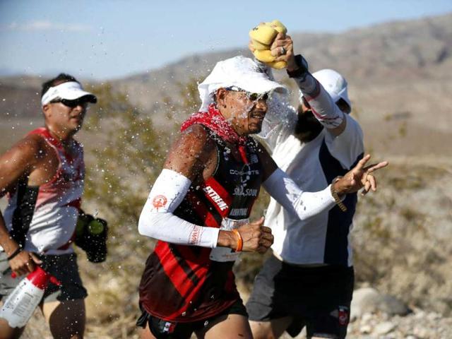 Oswaldo Lopez of Mexico, 41, (C) is doused with water during the Badwater Ultramarathon in Death Valley National Park, California. The 135-mile (217 km) race, which bills itself as the world's toughest foot race, goes from Death Valley to Mt Whitney, California in temperatures which can reach 130 degrees Fahrenheit (55 Celsius). REUTERS/Lucy Nicholson Oswaldo Lopez of Mexico, 41, (C) is doused with water during the Badwater Ultramarathon in Death Valley National Park, California. The 135-mile (217 km) race, which bills itself as the world's toughest foot race, goes from Death Valley to Mt Whitney, California in temperatures which can reach 130 degrees Fahrenheit (55 Celsius). REUTERS/Lucy Nicholson