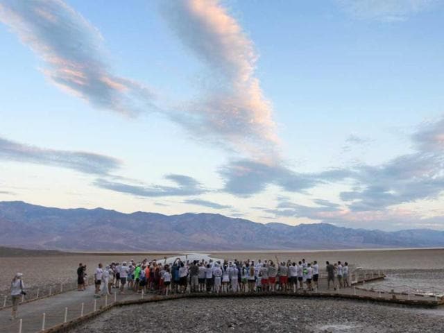 Runners gather at Badwater Basin for the start of the AdventurCORPS Badwater 135 ultra-marathon race in Death Valley National Park, California. Billed as the toughest footrace in the world, the 36th annual Badwater 135 starts at Badwater Basin in Death Valley, 280 feet below sea level, where athletes begin a 135-mile non-stop run over three mountain ranges in extreme mid-summer desert heat to finish at 8,350 feet above sea level near Mount Whitney for a total cumulative vertical ascent of 13,000 feet. David McNew/Getty Images/AFP Runners gather at Badwater Basin for the start of the AdventurCORPS Badwater 135 ultra-marathon race in Death Valley National Park, California. Billed as the toughest footrace in the world, the 36th annual Badwater 135 starts at Badwater Basin in Death Valley, 280 feet below sea level, where athletes begin a 135-mile non-stop run over three mountain ranges in extreme mid-summer desert heat to finish at 8,350 feet above sea level near Mount Whitney for a total cumulative vertical ascent of 13,000 feet. David McNew/Getty Images/AFP