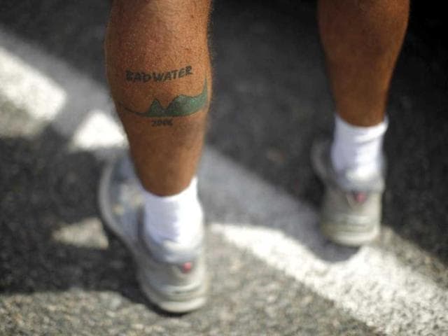 A man shows a Badwater tattoo during the Badwater Ultramarathon in Death Valley National Park, California. The 135-mile (217 km) race, which bills itself as the world's toughest foot race, goes from Death Valley to Mt. Whitney, California in temperatures which can reach 130 degrees Fahrenheit (55 Celsius). REUTERS/Lucy Nicholson A man shows a Badwater tattoo during the Badwater Ultramarathon in Death Valley National Park, California. The 135-mile (217 km) race, which bills itself as the world's toughest foot race, goes from Death Valley to Mt. Whitney, California in temperatures which can reach 130 degrees Fahrenheit (55 Celsius). REUTERS/Lucy Nicholson