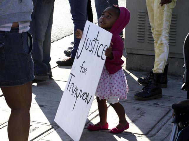 A girl holds a sign during a demonstration supporting Trayvon Martin in Los Angeles, California. (Reuters Photo)