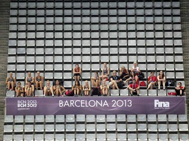 Competitors watch other teams practicing in the swimming pool ahead of the upcoming World Swimming Championships at the Sant Jordi arena in Barcelona. The World Swimming Championships will take place July 20 to August 4. Reuters photo