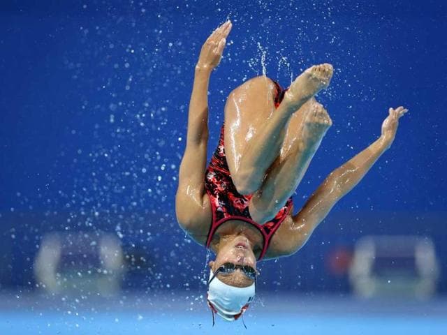 Switzerland's Pamela Fischer is thrown up in the air during a training session of the synchronized swimming team ahead of the FINA Swimming World Championships in Barcelona, Spain. AP Photo