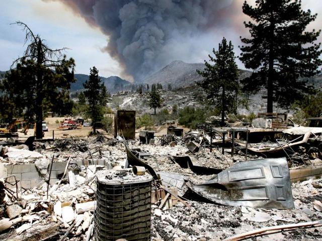 The burned remains of one of the homes on Bonita Vista Rd. near Lake Hemet, Calif., from the Mountain Fire, Tuesday July 16, 2013. The 14,200 acre forest fire near Idyllwild Calif., has caused Idyllwild and adjacent communities east of Highway 243 to issued mandatory evacuations for hundreds of homes Wednesday. AP Photo