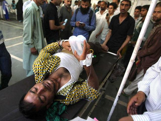 An injured Kashmiri from Gool lays on a hospital bed in Srinagar. The Border Security Force (BSF) personnel allegedly fired at protesters outside their camp in J&K's Ramban district. (HT Photo/Hindustan Times)