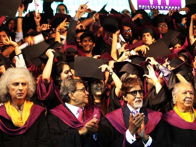 Whistling Woods graduates about to throw their caps.