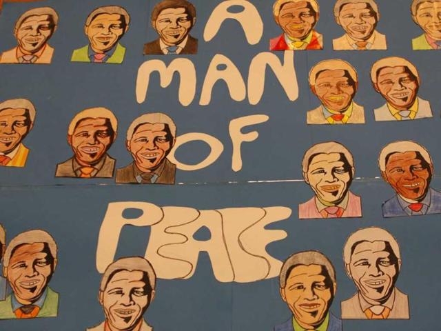 A birthday card made by learners from the Melpark Primary School in Johannesburg adorns a wall as learners celebrate former president Nelson Mandela's 95th birthday during their school assembly. AP Photo