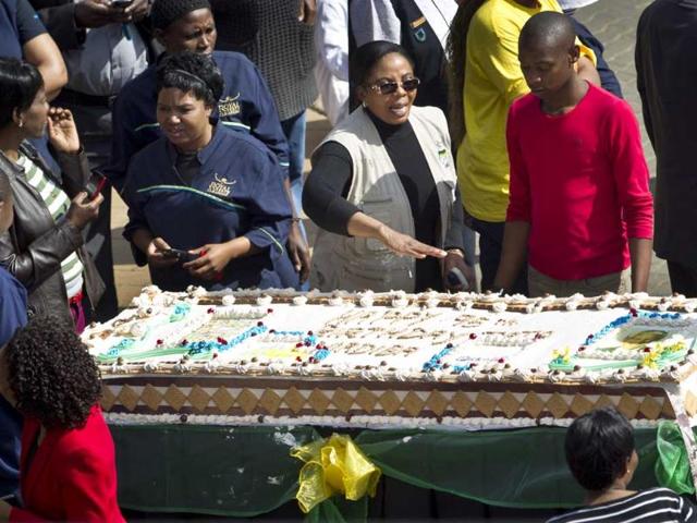 Guests and hospital workers prepare to cut a large birthday cake for Nelson Mandela in Pretoria, South Africa. AP Photo