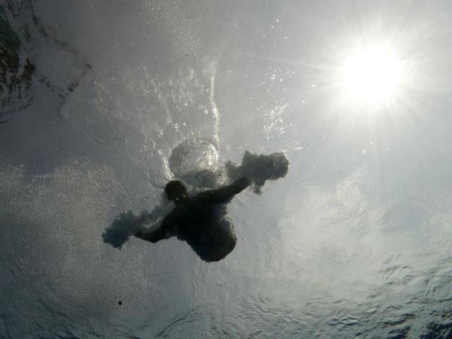 A diver trains on the 3-meter springboard at the FINA Swimming World Championships in Barcelona, Spain. (AP Photo)