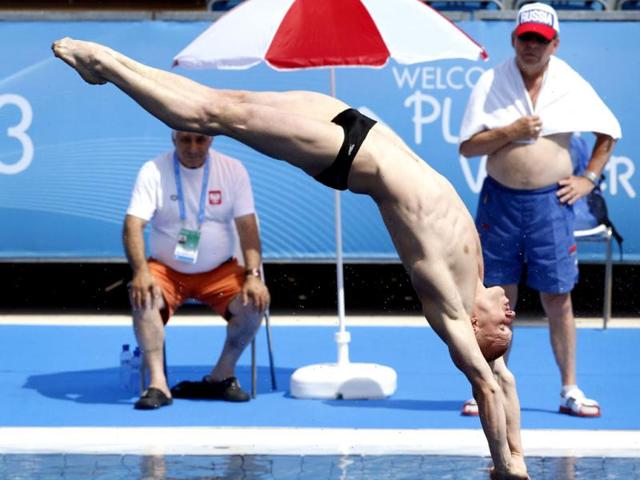 An unidentified 3-meter springboard diver leaves the pool during a training session ahead of the FINA Swimming World Championships in Barcelona, Spain. (AP Photo)