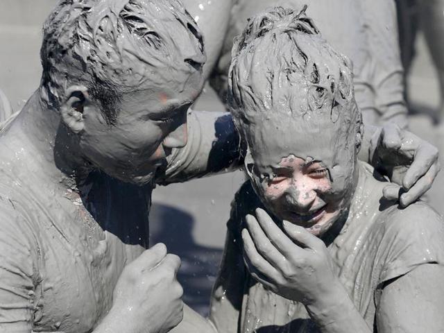 A couple play in the mud during the Boryeong Mud Festival at Daecheon beach in Boryeong, about 190 km (118 miles) southwest of Seoul. Reuters