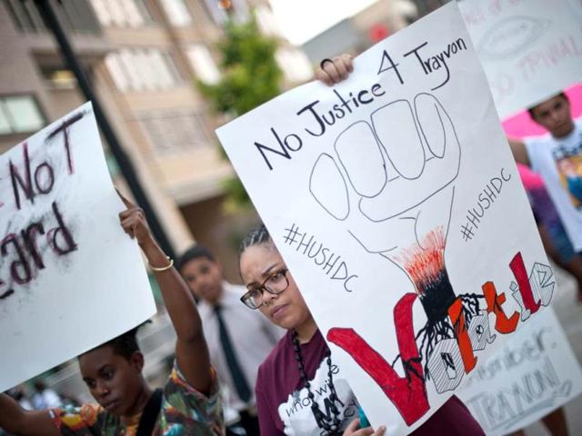 People march in Washington during a demonstration against the acquittal of George Zimmermann in the killing of Florida teen Trayvon Martin. (AFP Photo)