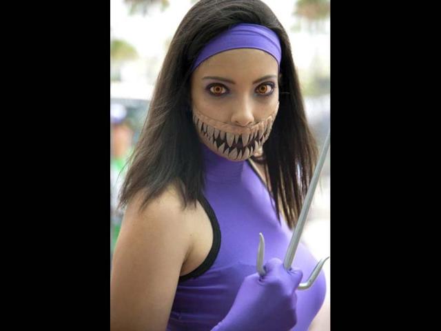 An attendee Mileenathe from the Mortal Kombat series of fighting video games at the Comic Con International 2013 at the San Diego Convention Center in California. (AFP Photo)